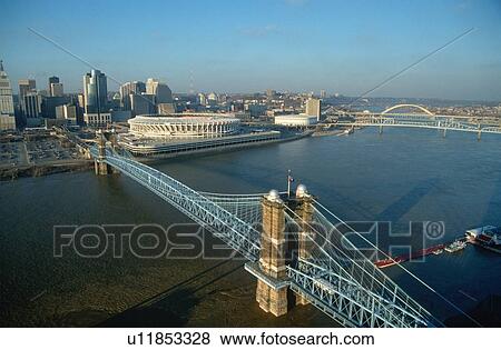 Stock Photo - Roebling Suspension Bridge and Three Rivers Stadium on the Ohio River in Cincinnati, Ohio. Fotosearch