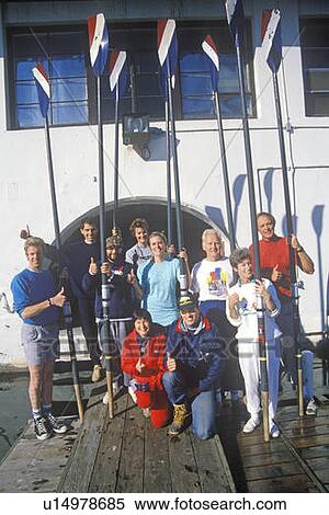 Rowing team pose with oars View Large Photo Image Stock Photography - Rowing team pose with oars. Fotosearch