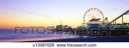 Stock Photo - Santa Monica Pier at sunset, California. Fotosearch