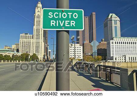 Stock Image - Scioto River Sign in Columbus Ohio, with setting sunlight. Fotosearch