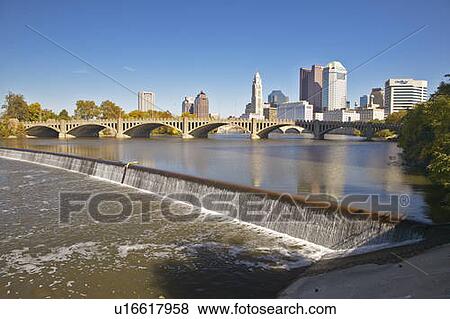 Scioto River with waterfall and Columbus Ohio skyline, with setting sunlight View Large Photo Image Stock Photo - Scioto River with waterfall and Columbus Ohio skyline, with setting sunlight. Fotosearch