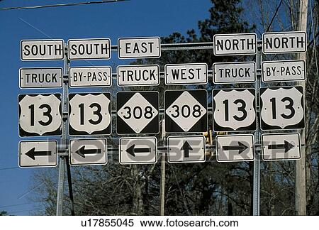 Set of road signs offering directions at a fork in the road View Large Photo Image Stock Photography - Set of road signs offering directions at a fork in the road. Fotosearch