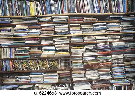 Shelves filled with paperback books View Large Photo Image Stock Image - Shelves filled with paperback books. Fotosearch