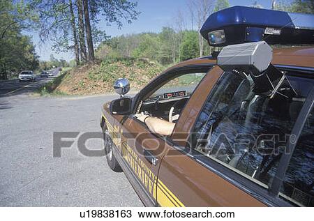 Sheriff sitting in car at speed trap View Large Photo Image Stock Image - Sheriff sitting in car at speed trap. Fotosearch
