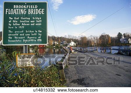 Stock Image - Sign with Brookfield Floating Bridge over Sunset Lake, Brookfield, VT. Fotosearch