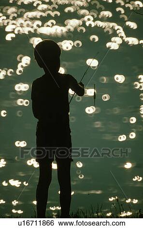 Silhouette of boy fishing View Large Photo Image Stock Photograph - Silhouette of boy fishing. Fotosearch