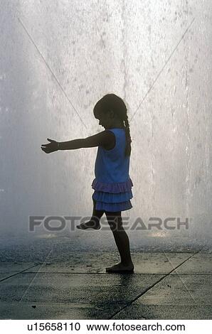 Silhouette of little girl playing in fountain View Large Photo Image Stock Image - Silhouette of little girl playing in fountain. Fotosearch