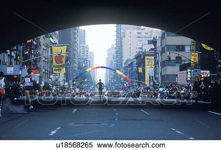 Silhouette of runner in NY City Marathon on 1st Avenue View Large Photo Image Stock Photography - Silhouette of runner in NY City Marathon on 1st Avenue. Fotosearch