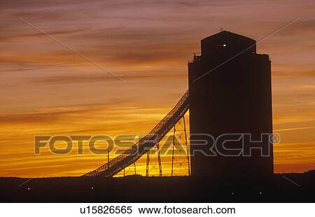 Silhouetted grain silo at sunset View Large Photo Image Stock Photography - Silhouetted grain silo at sunset. Fotosearch