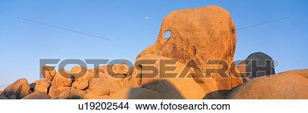 Skeleton Rock and Moon at Sunset, Joshua Tree, California View Large Photo Image Picture - Skeleton Rock and Moon at Sunset, Joshua Tree, California. Fotosearch