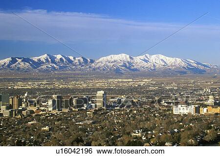 Skyline of Salt Lake City, UT with Snow capped Wasatch Mountains in background View Large Photo Image Stock Photograph - Skyline of Salt Lake City, UT with Snow capped Wasatch Mountains in background. Fotosearch
