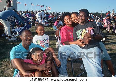 Stock Image - Smiling African American family at Black Family Reunion Celebration. Fotosearch