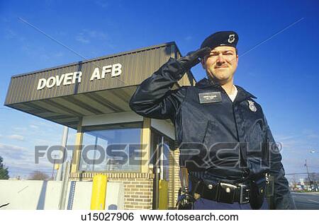 Stock Photograph - Soldier Saluting at Main Gate of Dover Airforce Base, Dover, Delaware. Fotosearch