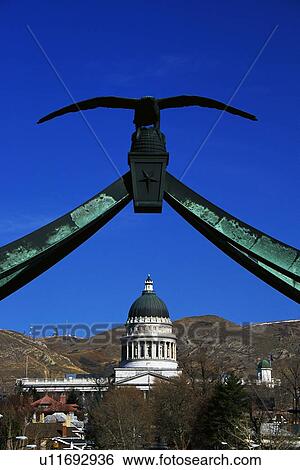 Stock Photograph - State Capitol building with the eagle gate above it. Fotosearch