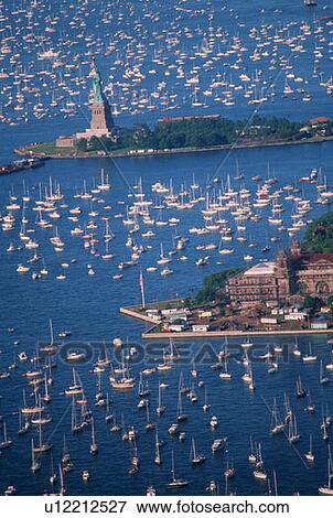 Stock Photo - Statue of Liberty, Aerial View & Sailing Ships in Harbor, New York, New York. Fotosearch