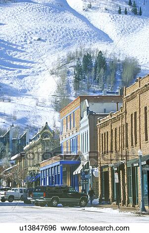 Stock Photograph - Storefronts and ski slope in the town of Aspen, Colorado. Fotosearch