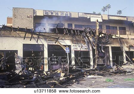 Stock Photo - Strip mall burned out during 1992 riots, South Central Los Angeles, California. Fotosearch