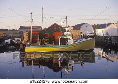 Stock Photo - Sunrise on fishing village. Fotosearch