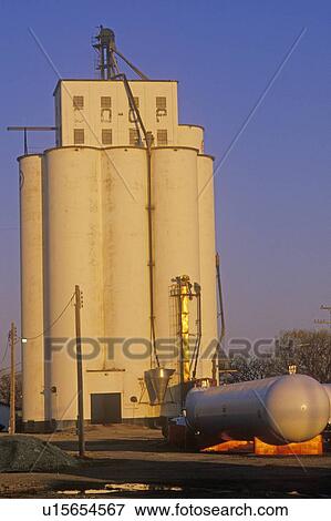 Sunrise over a large commercial grain silo View Large Photo Image Stock Photo - Sunrise over a large commercial grain silo. Fotosearch