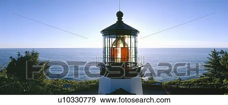 Stock Photo - Sunset at Cape Meares Lighthouse from 1890, Oregon. Fotosearch