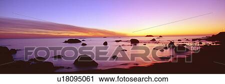 Stock Image - Sunset on rocky Pacific shoreline, Northern California. Fotosearch
