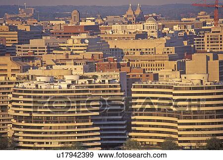 Stock Photo - Sunset on the Watergate Building and Washington, DC. Fotosearch