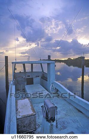 Stock Photography - Sunset over storm clouds on Pine Island, Florida. Fotosearch