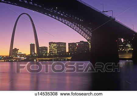 Stock Photo - Sunset view of St. Louis, Mo skyline and Eads Bridge. Fotosearch