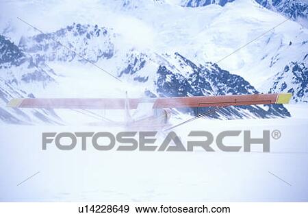 Stock Photo - Super Cub. Piper bush airplane on glacier. Fotosearch