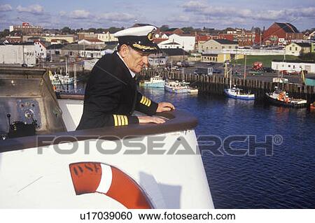 Stock Image - The captain of the Bluenose atop the ferry to guide it into the dock. Fotosearch