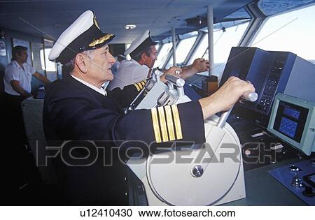 The captain of the ferry Bluenose piloting the ship View Large Photo Image Stock Image - The captain of the ferry Bluenose piloting the ship. Fotosearch