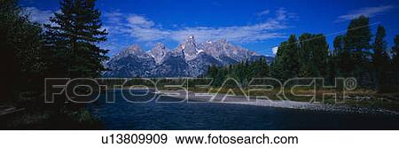 Stock Photo - These are the mountain peaks along the Snake River in the Grand Tetons. Fotosearch