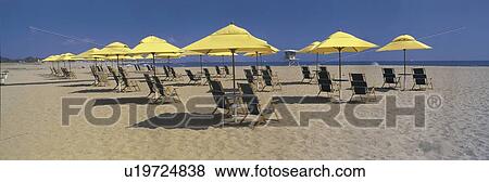 Stock Photo - These are yellow square umbrellas on the Ventura Beach. Fotosearch