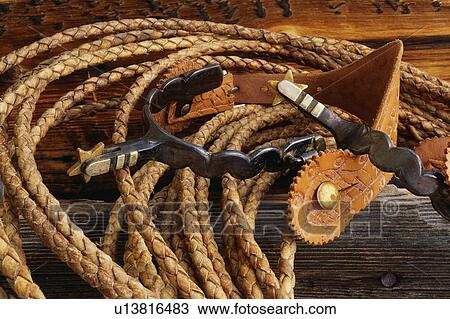 This is a close up of a rope and spurs taken at a cattle drive.  View Large Photo Image Stock Image - This is a close up of a rope and spurs taken at a cattle drive. . Fotosearch