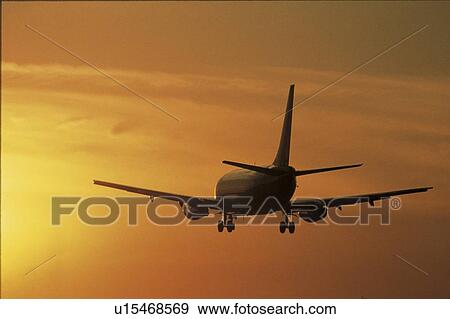 This is a jet taking off into the sunset View Large Photo Image Stock Photo - This is a jet taking off into the sunset. Fotosearch