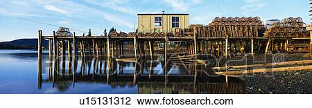 This is a pier with a small square wooden shack View Large Photo Image Stock Image - This is a pier with a small square wooden shack. Fotosearch