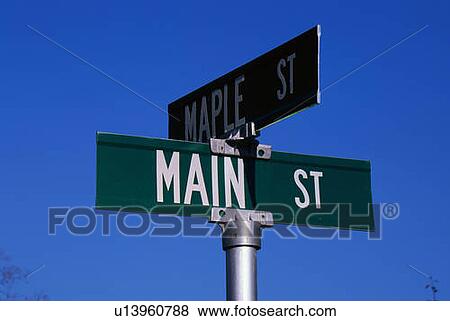 This is a street sign labeling the corner of Main Street & Maple Street View Large Photo Image Stock Photo - This is a street sign labeling the corner of Main Street & Maple Street. Fotosearch