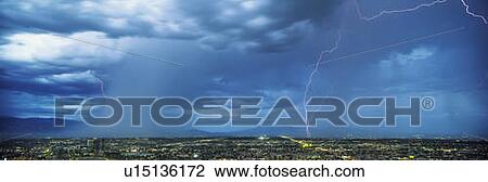Stock Image - This is an electrical storm with rain over the city.. Fotosearch