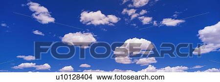 This is an image of a blue sky with white puffy clouds scattered throughout. View Large Photo Image Picture - This is an image of a blue sky with white puffy clouds scattered throughout.. Fotosearch