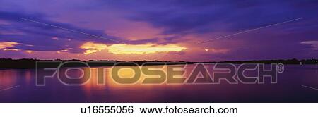Stock Photograph - This is the ocean and Pine Island at sunset. Fotosearch