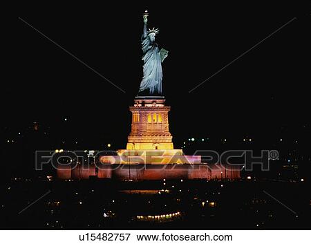 This is the Statue of Liberty lit up at night View Large Photo Image Stock Photo - This is the Statue of Liberty lit up at night. Fotosearch