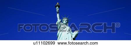 This is the top half of the Statue of Liberty against a blue sky in horizontal format. View Large Photo Image Stock Photo - This is the top half of the Statue of Liberty against a blue sky in horizontal format.. Fotosearch