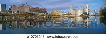 This shows an industrial building through a clearing of trees on the Rogue River. View Large Photo Image Stock Photography - This shows an industrial building through a clearing of trees on the Rogue River.. Fotosearch
