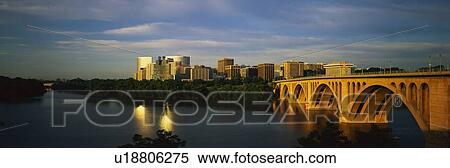 Stock Photography - This shows sunrise over the Key Bridge on the Potomac River. Fotosearch
