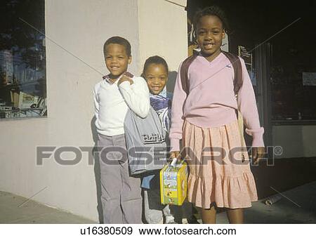 Stock Photo - Three African-American elementary schoolchildren. Fotosearch