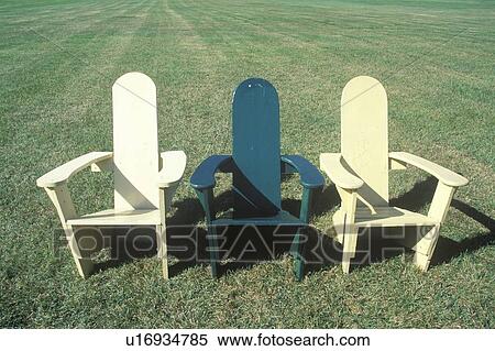 Stock Photography - Three lawn chairs on lawn. Fotosearch