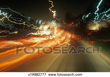 Stock Photo - Time exposure of highway lights at night. Fotosearch