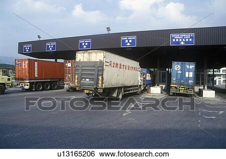 Toll gate and trucks leaving Hong Kong View Large Photo Image Stock Photograph - Toll gate and trucks leaving Hong Kong. Fotosearch