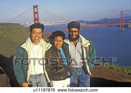 Tourists from Malaysia pose for a picture with the Golden Gate Bridge View Large Photo Image Stock Photograph - Tourists from Malaysia pose for a picture with the Golden Gate Bridge. Fotosearch