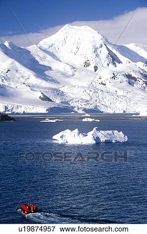 Stock Photo - Tourists in inflatable boat. Fotosearch